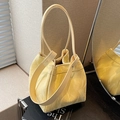Pale yellow bucket bag with marble texture, featuring versatile dual straps for women - Yellow