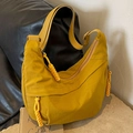 Mustard yellow nylon hobo crossbody bag with adjustable wide strap and knotted zipper detail - Yellow
