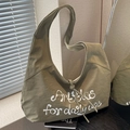 Grande borsa a tracolla in tela verde oliva con stampa 'Articles for daily use' - Verde