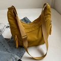 Bright yellow nylon crescent dumpling bag with adjustable shoulder strap and woven zipper pull - Yellow