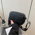 Minimalist black embossed rose crossbody bag with wide patterned jacquard strap - Black