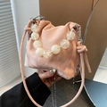 Pink pleated dumpling bucket bag with beaded handle and marble texture finish - Pink