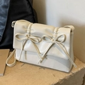 Beige crossbody bag with pleated finish and bow detail on stone platform - Off White