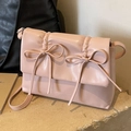 Pale pink pleated crossbody bag with double bow detail and smooth PU leather finish - Pink
