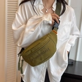 Army green nylon crossbody waist bag with embossed letters and orange logo tag details - Green