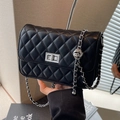 Chic black quilted chain shoulder bag with silver metal ball accent and rotating lock - Black