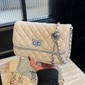 Cream white quilted crossbody bag with silver adjustable ball chain and sleek metal lock - Beige