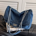 Blue denim crossbody tote bag with silver chain strap and metal swivel lock closure - Blue