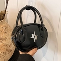 Minimalist black oval handbag in sleek PU leather featuring artistic silver metal clasp - Black