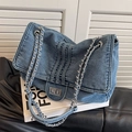 Blue denim flap shoulder bag with silver chain strap and metal twist lock design - Light Blue
