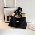Bolso tote de lona minimalista con costuras en contraste y logo de marca de cuero - Negro