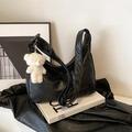 Black hobo shoulder bag in soft leather with a cute white plush bear pendant detail - Black