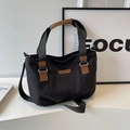 Borsa tote minimalista in tela nera con finiture in pelle marrone e tracolla - Nero
