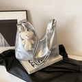 Silver metallic hobo shoulder bag with fuzzy bear charm and wide strap detail - Silver