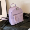 Mini lavender faux leather backpack for women with pebbled texture and silver zipper - Purple