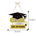 Detail of graduation door hanger featuring a black mortarboard and golden book accents - Book Inspirational Slogan Style (L-00282-2)