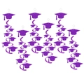 Purple glitter graduation party swirl decorations featuring academic cap pendants - Purple