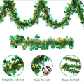 Close-up of St. Patrick's Day tinsel garland with green clovers and golden sparkles - 2m Glitter Shamrock Tinsel Garland
