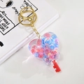 Porte-clés créatif en forme de cœur avec sable mouvant liquide et anneau doré en métal - Rose Rouge