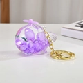 Portachiavi elicottero viola con perline galleggianti e catena dorata su base bianca - Catena Oro Chiaro + Aereo Luminoso / Viola