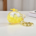 Dettaglio portachiavi a elicottero con perline gialle glitterate in plastica trasparente - Catena Oro Chiaro + Aereo Luminoso / Giallo Limone
