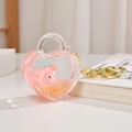 Détail du porte-clés shaker cœur rose en acrylique avec paillettes liquides et breloque - Rose