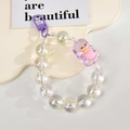 Macro shot of iridescent acrylic beads with purple mermaid charm and lobster clasp - Mermaid Chain / Gate Buckle Chain / Purple