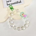 Macro detail of acrylic beaded chain with green mermaid charm and metallic lobster clasp - Mermaid Chain / Gate Buckle Chain / Green