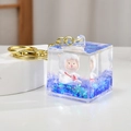 Cute lamb liquid sand keychain in clear square bottle with blue floating glitters - Purple