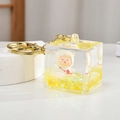 Macro detail of square acrylic keychain with yellow liquid sand and cartoon sheep - Lemon Yellow