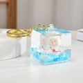 Creative square acrylic keychain with blue floating sand and a cute cartoon sheep toy - Blue