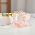 Cute lamb cube liquid keychain with pink glitters and gold metal ring for bags - Pink