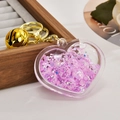 Gros plan du porte-clés en forme de cœur avec paillettes roses et clochette dorée - Chaîne Or Clair + Cœur Lumineux + Clochette / Violet