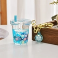 Portachiavi creativo a tazza di tè al latte con liquido blu e paillettes a stella - Stile tazza di tè al latte luminosa / Blu
