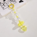 Detail of yellow beaded bag charm featuring acrylic bow, cloud, and heart pendants - Lemon Yellow