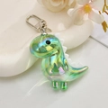 Llavero de dinosaurio iridiscente en verde suave con acabado aurora para bolsos - Verde