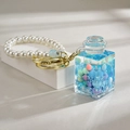 Blue quicksand bottle keychain with macaron beads and elegant white pearl strap - Chain Style [Blue]