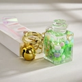 Green liquid sand bottle keychain with golden bell and laser strap detail - Green with Laser Strap