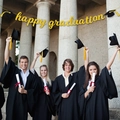 Golden glitter 'happy graduation' banner with black graduation cap icons for party decor - Gold happy graduation