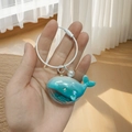 Iridescent blue-green whale acrylic keychain with pearl charm and steel wire ring - Wire Ring Whale Pearl / Color Ring Blue