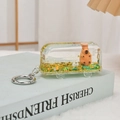 Creative bus-shaped capybara quicksand keychain with yellow glitters on a book - Gold Green