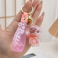 Pink astronaut liquid keychain with floating glitter and silicone wrist strap handle - Pink Astronaut
