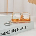 Cute capybara cartoon character inside transparent bus keychain with golden flowing sand - Gold Red