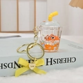 Cute milk tea cup liquid keychain with floating clownfish and yellow ribbon charm - Orange Clownfish
