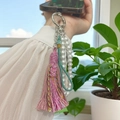 Handmade phone charm with purple tassels, white pearls, and green braided cord on a device - Full Set (Silver Ring + Tassel + Pearl Chain + Phone Patch) / Pink