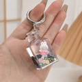 Handheld cute white bunny acrylic liquid oil keychain with pink accents and silver ring - Small Square Bottle