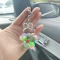 Detail of cute acrylic rabbit keychain with liquid sand and carrot charms inside - Rabbit Green