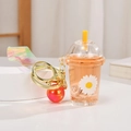 Portachiavi bubble tea arancione con stampa margherita ed effetto sabbie mobili liquide - Tazza di tè al latte luminosa con margherite / Arancione