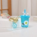 Blue bubble tea liquid keychain with daisy print and laser wrist strap accessory - Daisy Quicksand Glowing Milk Tea Cup / Blue