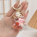Detail of pink bear and red strawberry inside a star-shaped liquid drifting bottle - Pink Without Bear